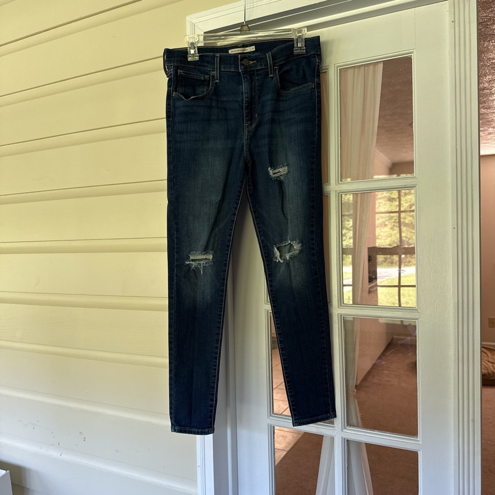 Levi's Dark Blue Skinny Jeans with Distressed Details